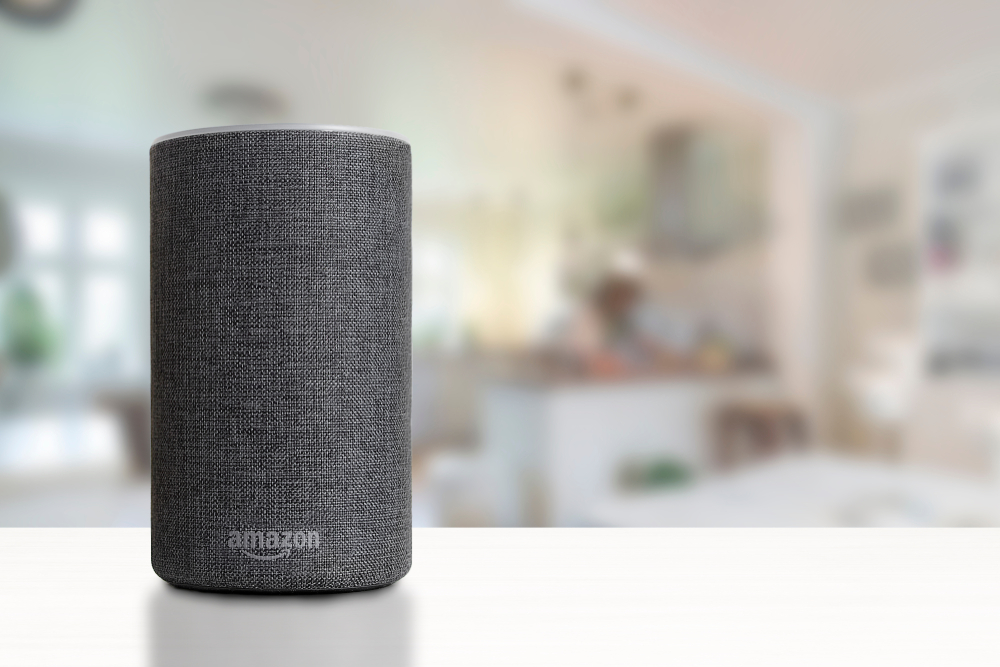 an amazon echo speaker sitting on top of a table
