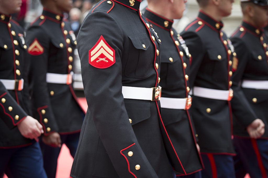 a group of men in military uniforms standing next to each other