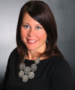 a woman in a black shirt is smiling for the camera