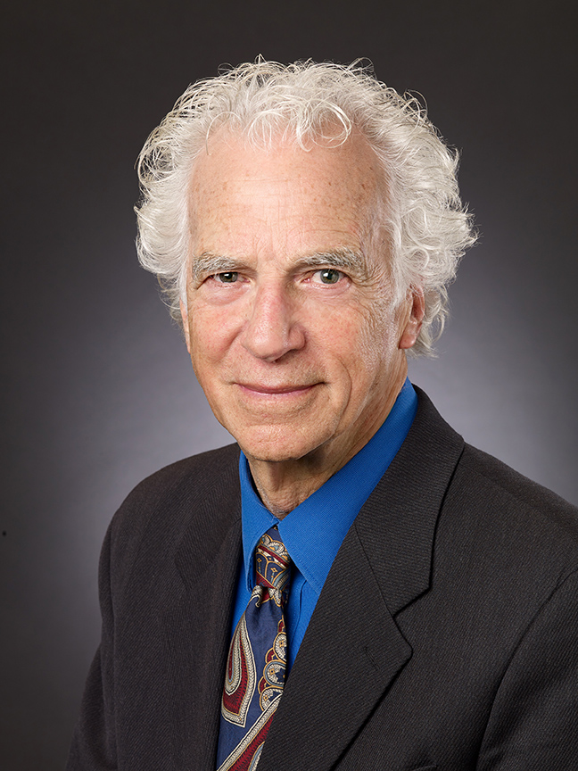 an older man in a suit and tie