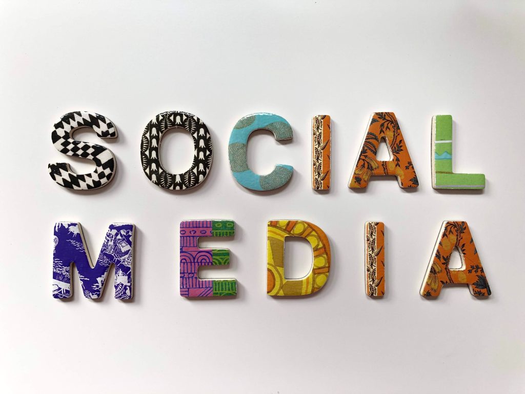 the word social media spelled with colorful letters