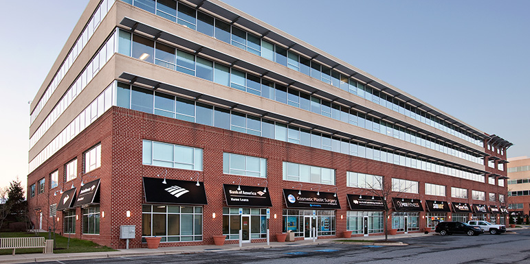 a building with cars parked in front of it