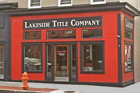 a red building with black trim and windows