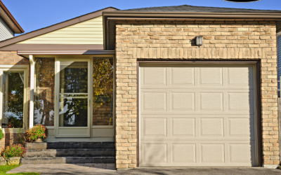 a brick house with a large garage door