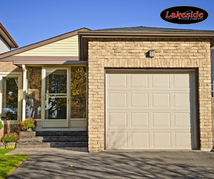 a brick house with a large garage door