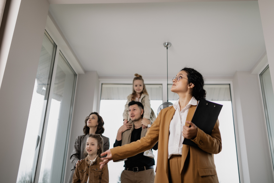 a real estate agent showing a home to a family